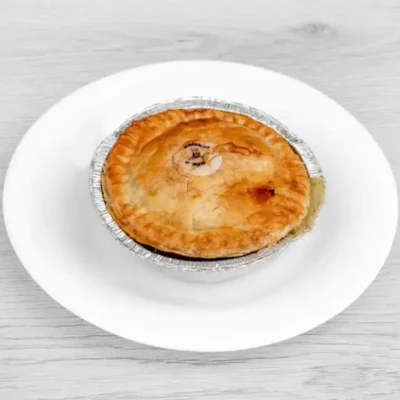 Golden baked chicken and ham pie with a flaky pastry crust.