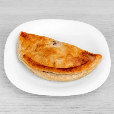 Golden-baked Chicken Tikka Pasty filled with tender chicken and aromatic spices.