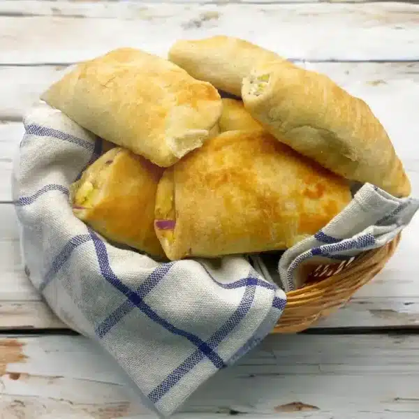 Our 12x Cocktail Cheese & Onion Pasties are perfect for parties, picnics, or snacking. Each mini pasty is filled with a rich blend of cheese and sweet onion, wrapped in our signature golden flaky pastry. Vegetarian-friendly and bursting with flavour, they’re ideal served warm or cold and guaranteed to be a crowd-pleaser.