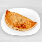 Freshly baked traditional Moore’s pasty with golden flaky pastry.