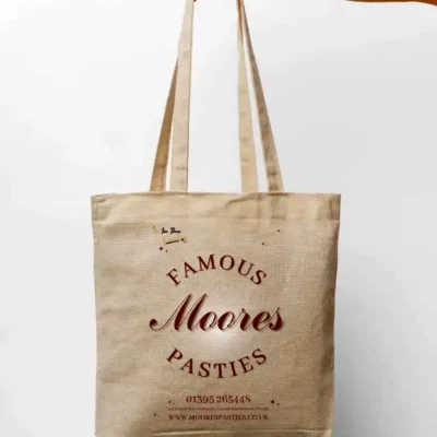 Moores Pasties branded reusable tote bag in natural cotton.