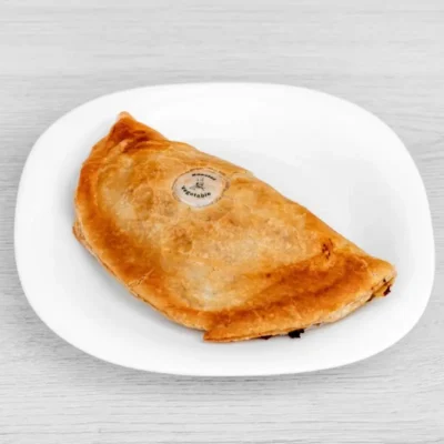 Golden baked vegan pasty filled with a medley of seasonal, flavour-packed roasted vegetables.