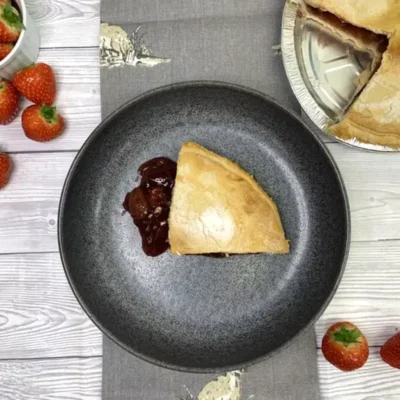 Golden baked strawberry pie with sweet, juicy strawberry filling.